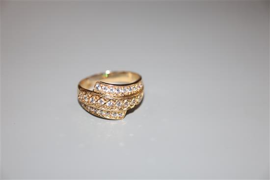 A modern 585 yellow metal and three row diamond set dress ring, size W, gross 5.2 grams.